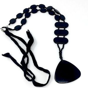 Black Acrylic Curved Triangular Pendant Necklace on Black Ribbon Cord